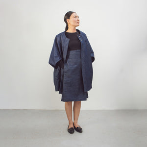 Woman wearing The Costume Room Raw Organic Denim Asymmetric Skirt