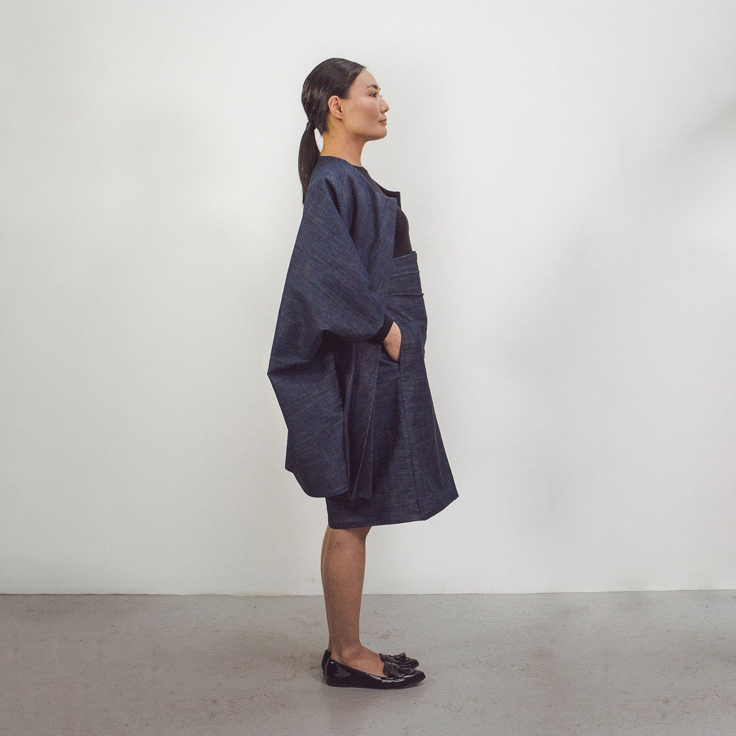 Woman wearing The Costume Room Raw Organic Denim Cocoon Coat