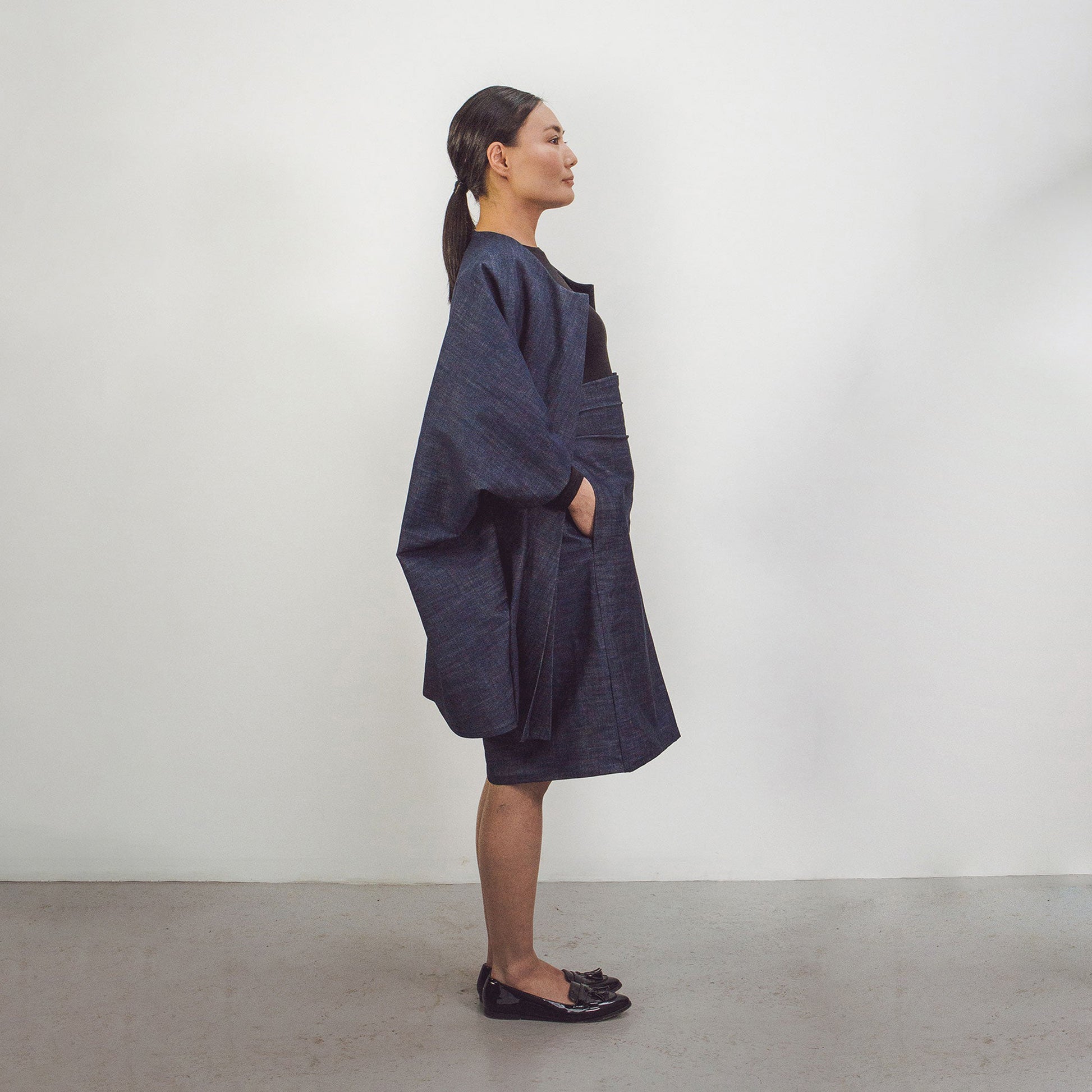Woman wearing The Costume Room Raw Organic Denim Cocoon Coat
