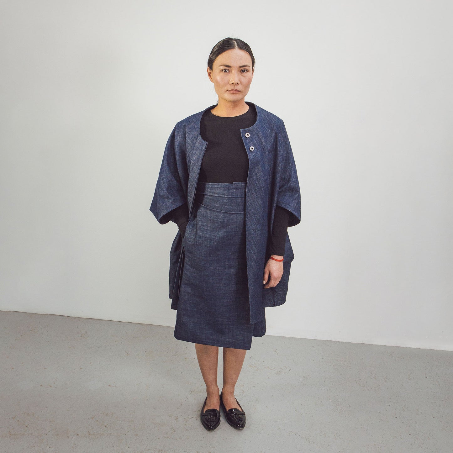 Woman wearing The Costume Room Raw Organic Denim Cocoon Coat
