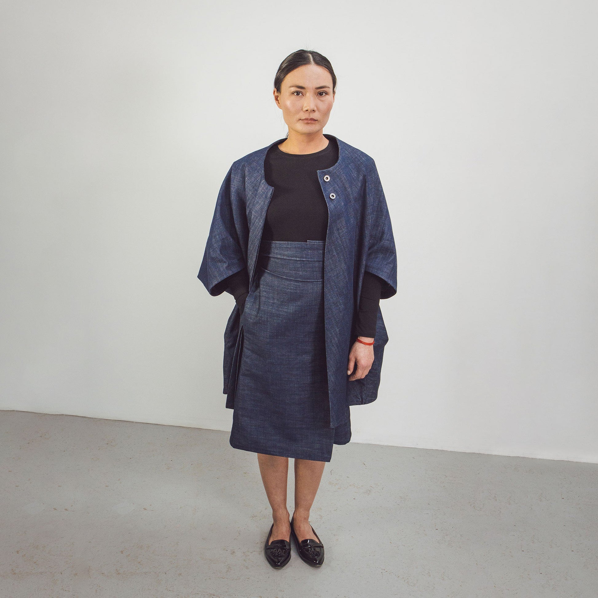 Woman wearing The Costume Room Raw Organic Denim Cocoon Coat