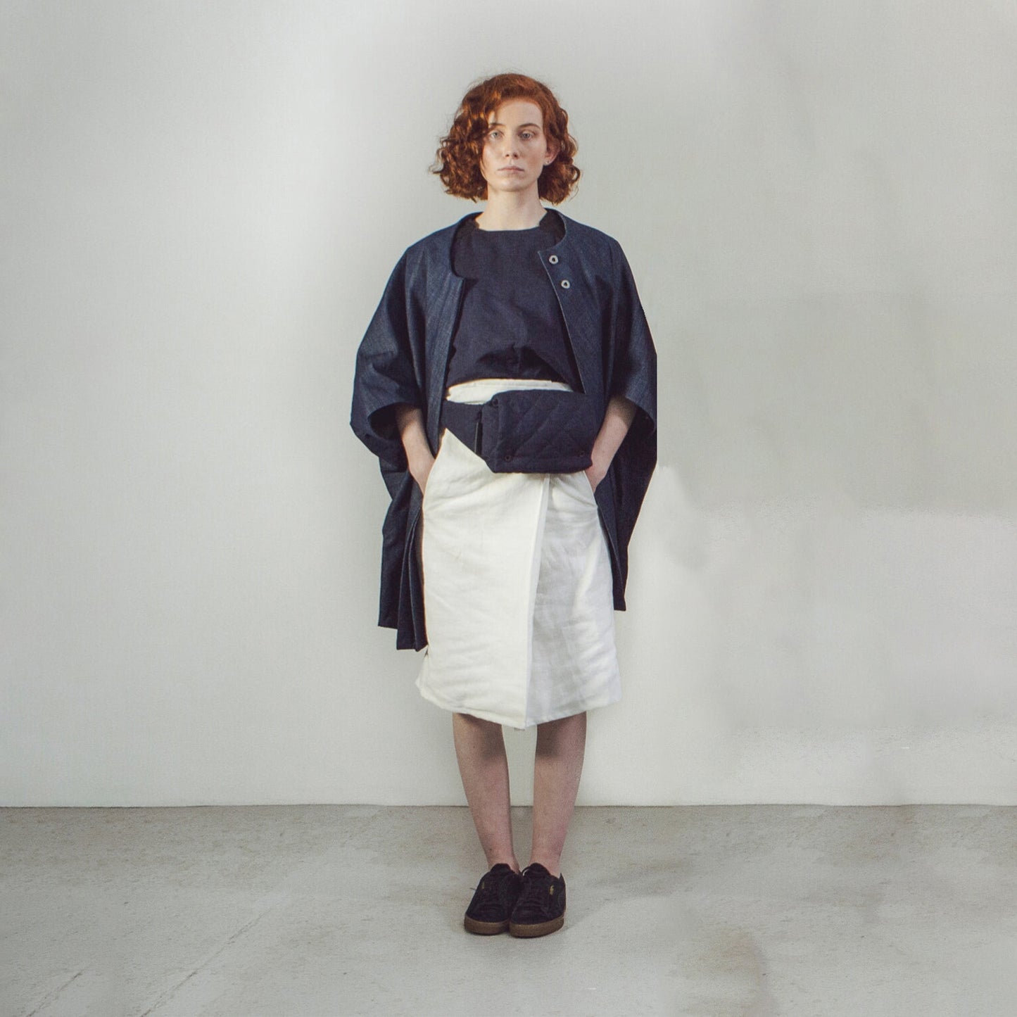 Woman with red hair wearing The Costume Room Raw Organic Denim Cocoon Coat