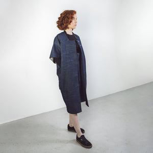 Woman with red hair wearing The Costume Room Raw Organic Denim Cocoon Long Jacket