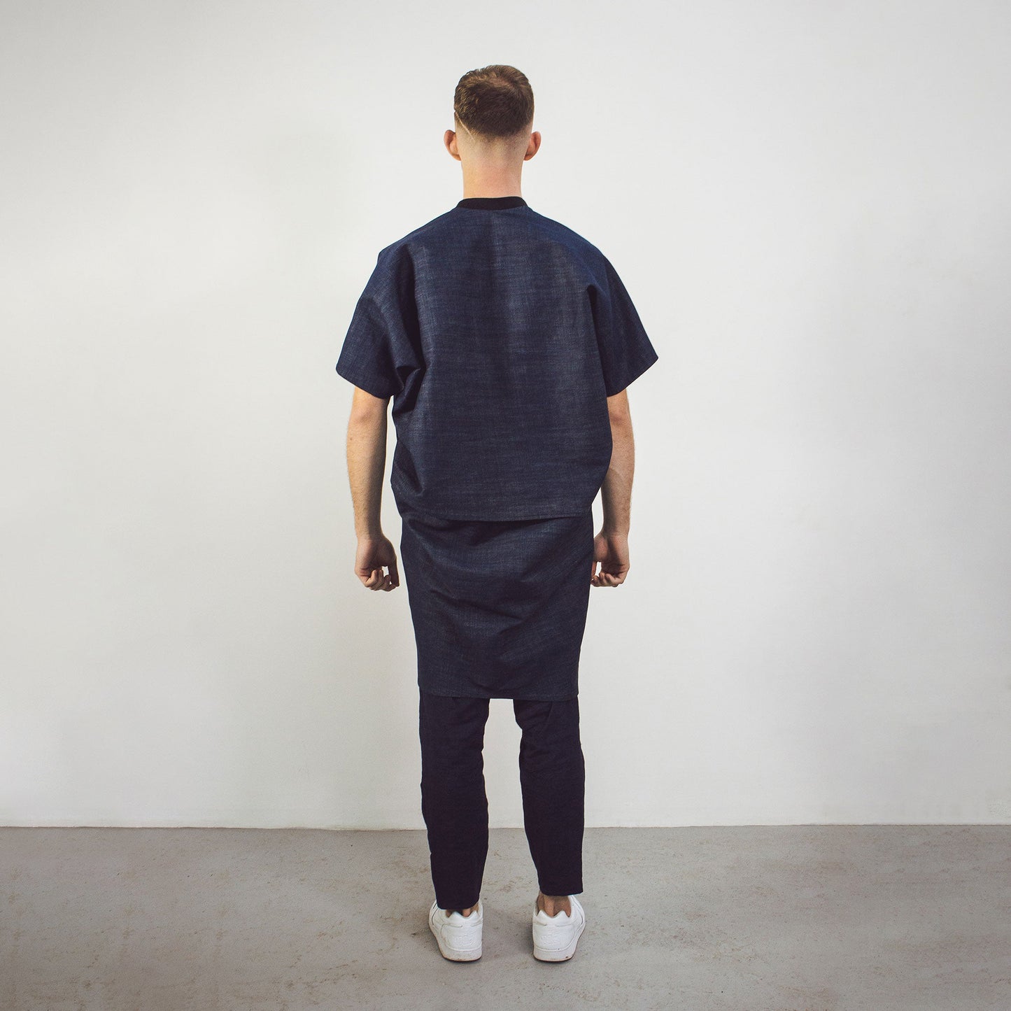 Man wearing The Costume Room Raw Organic Denim Cocoon Long Jacket