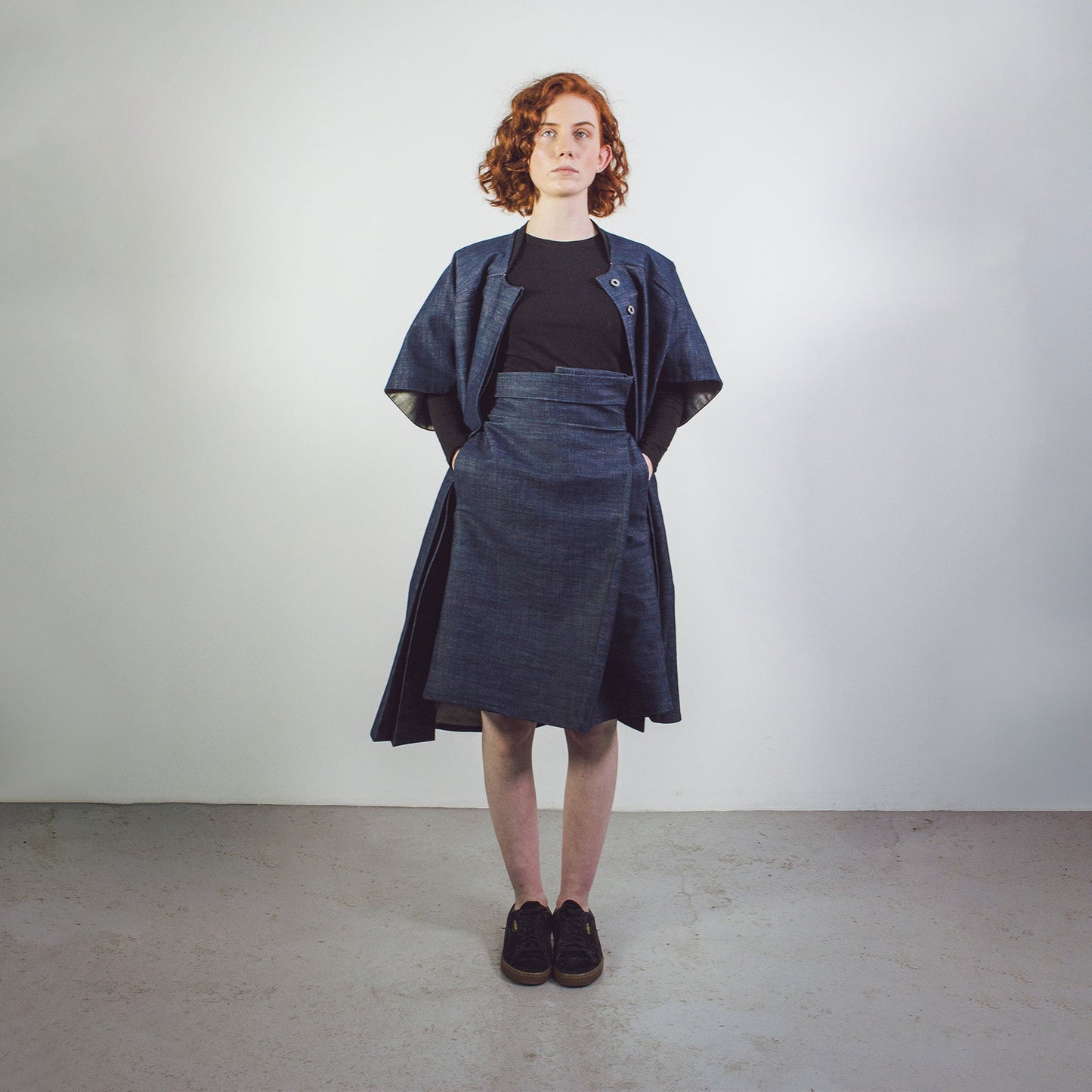 Woman with red hair wearing The Costume Room Raw Organic Denim Cocoon Long Jacket