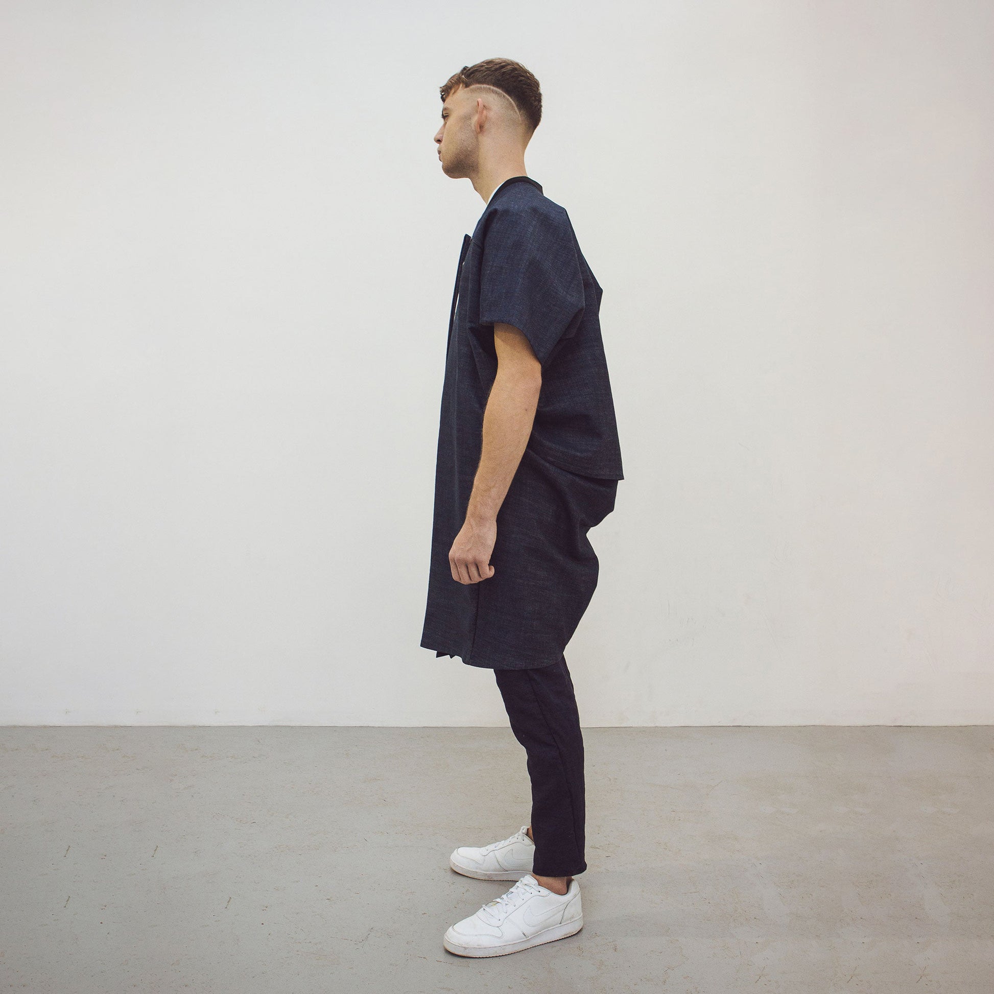 Man wearing The Costume Room Raw Organic Denim Cocoon Long Jacket