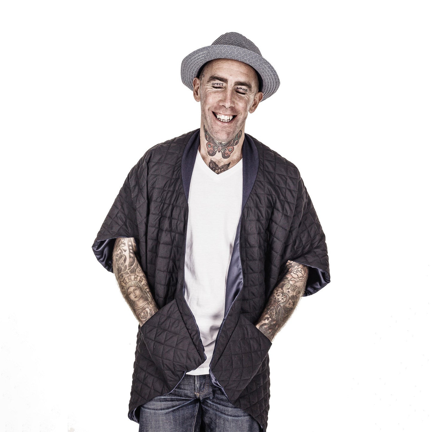 Man smiling wearing The Costume Room The Gar coat kimono style black linen quilted coat