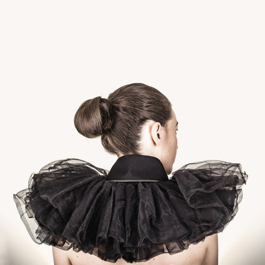 Woman wearing The Costume Room The Alexander has gold zip on a rounded black linen collar with tulle