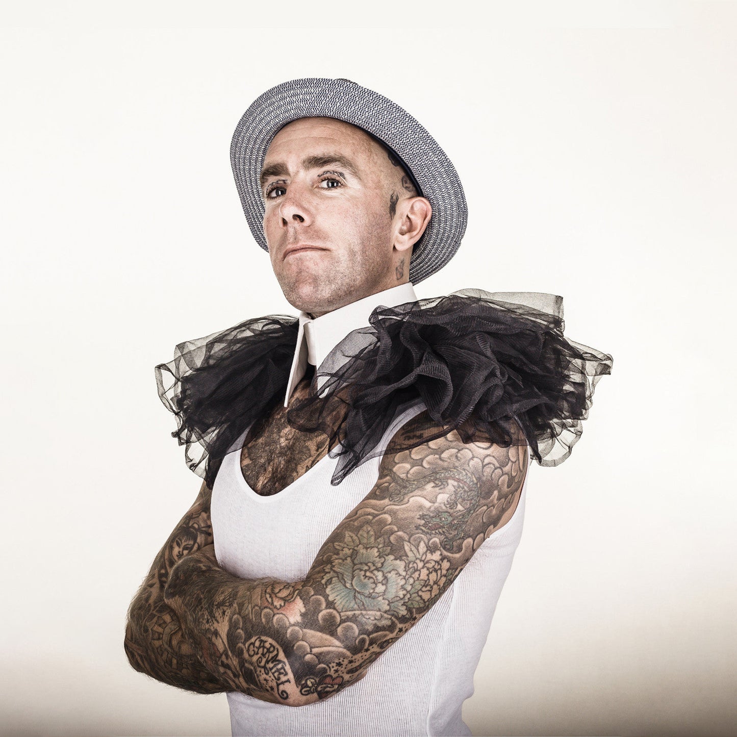 Man wearing The Costume Room The Gabrielle collar has a white linen pointed collar with black tulle