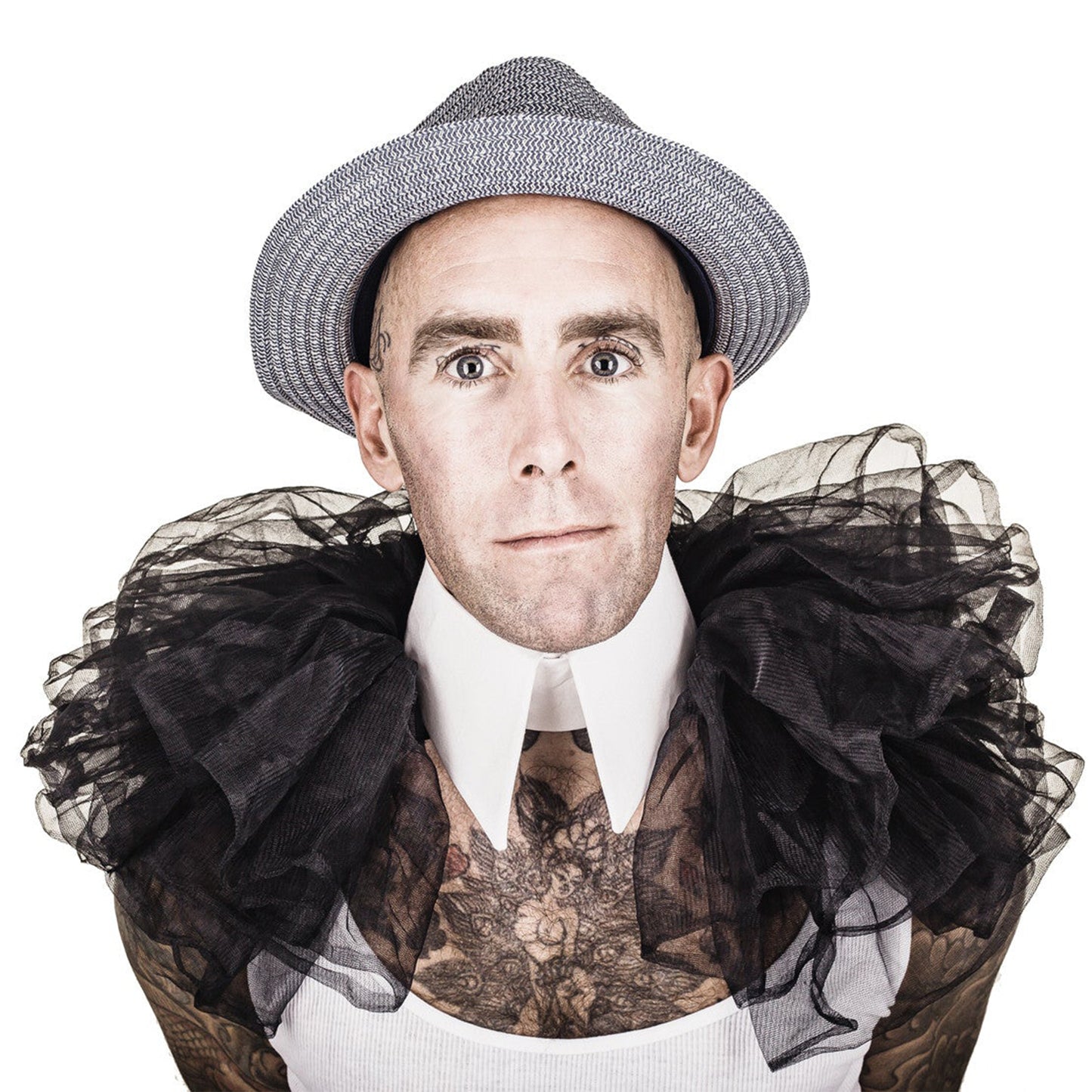 Man wearing The Costume Room The Gabrielle collar has a white linen pointed collar with black tulle