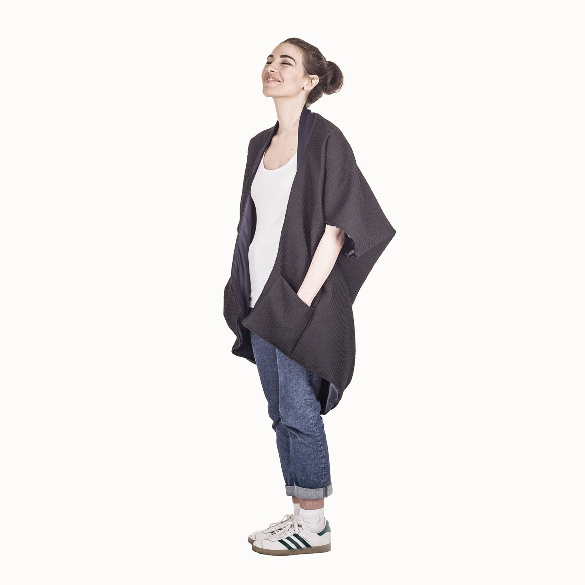 Woman wearing The Costume Room The Iris kimono style black waffle weave coat with navy blue collar