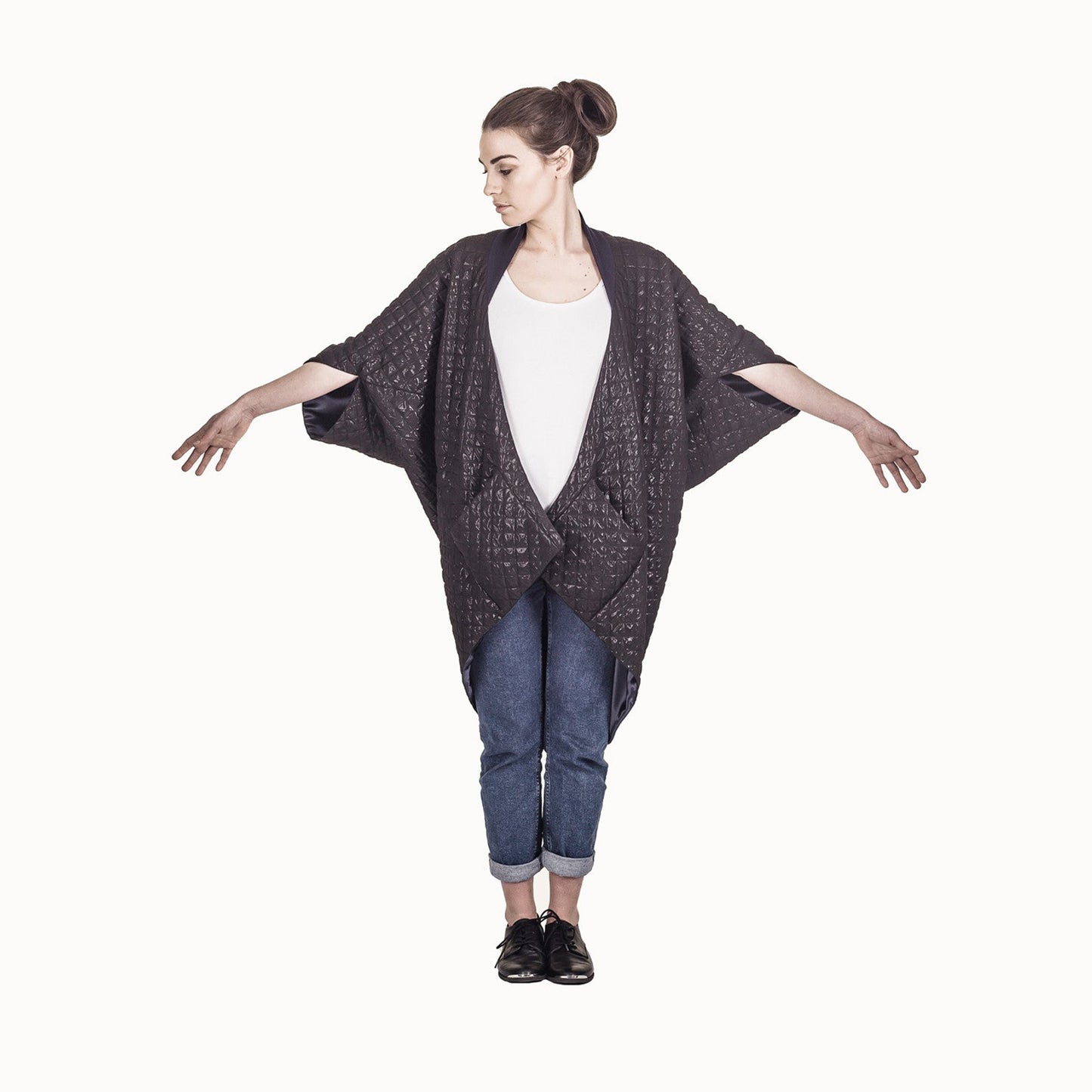 Woman wearing The Costume Room The Shell kimono style black shiny coat with navy blue collar