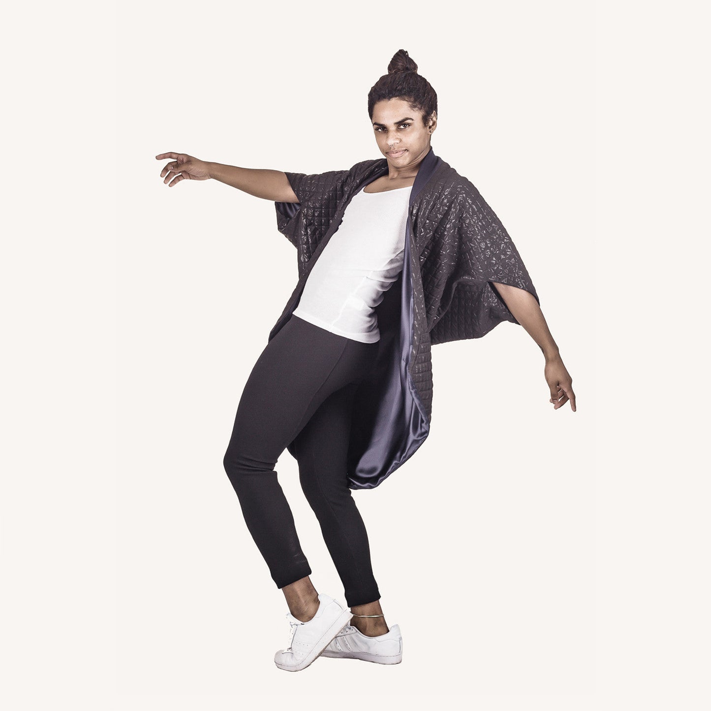 Man wearing The Costume Room The Shell kimono style black shiny coat with navy blue collar