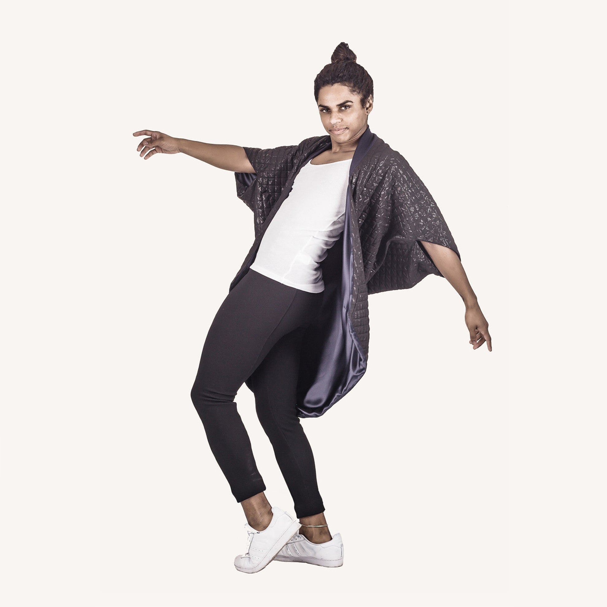 Man wearing The Costume Room The Shell kimono style black shiny coat with navy blue collar