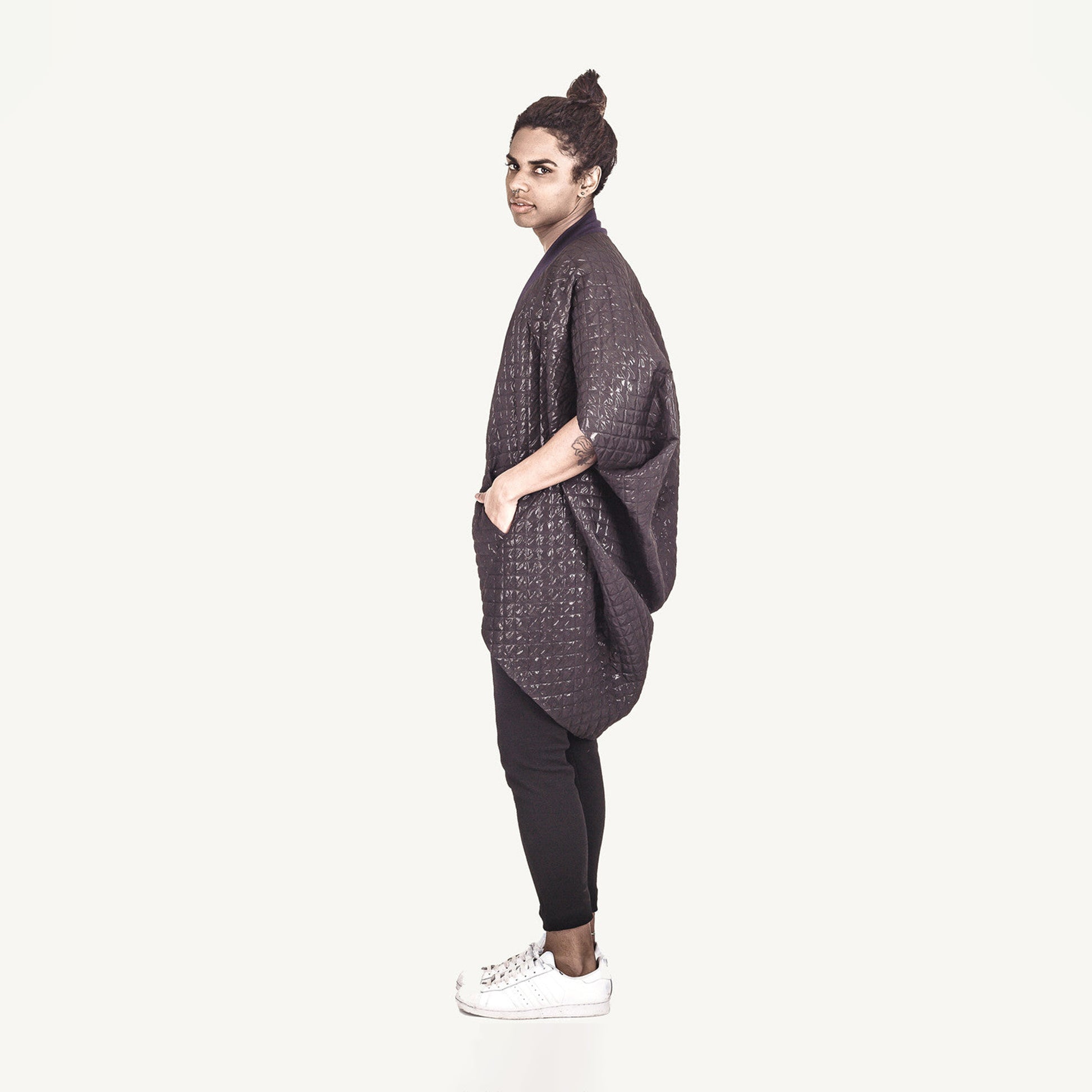 Man wearing The Costume Room The Shell kimono style black shiny coat with navy blue collar